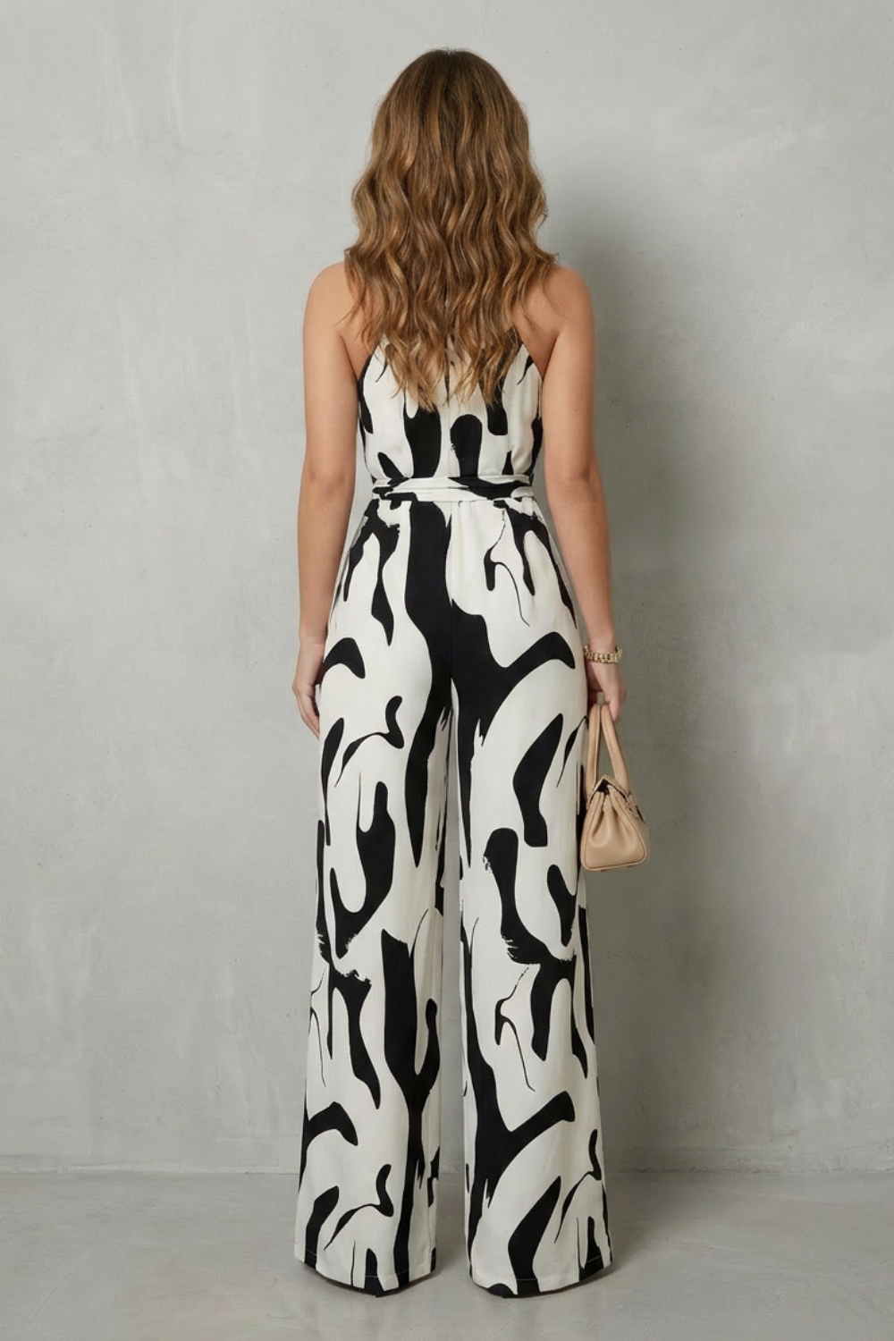 Calivana – Macacão pantalona frente única com estampa abstrata
