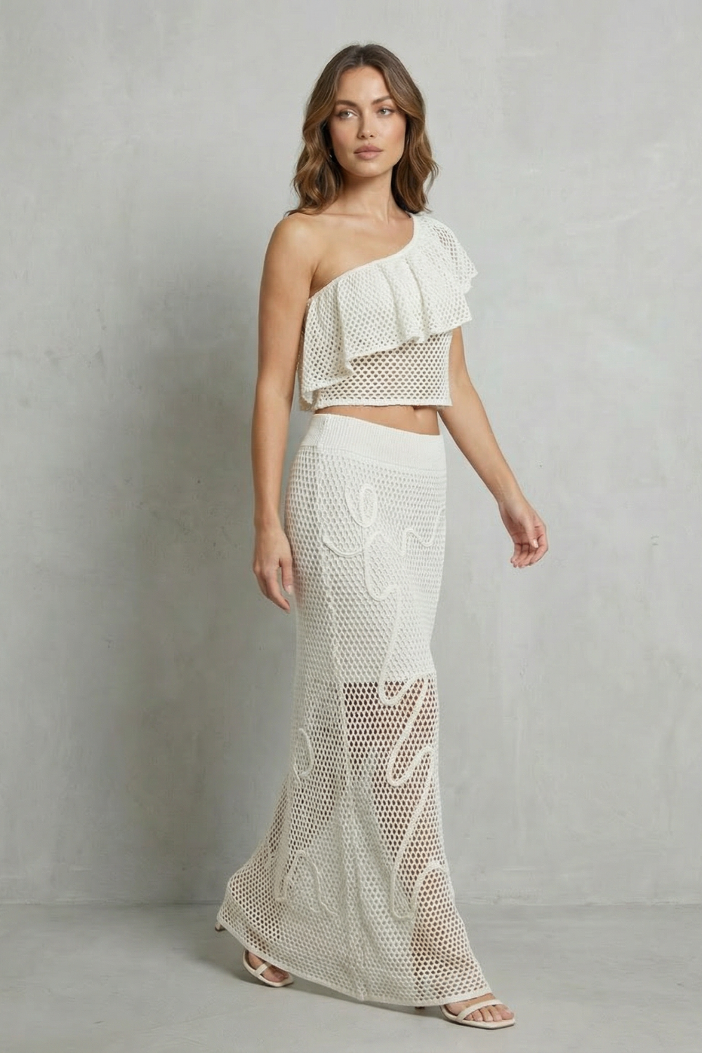 Solmara – Elegância com babados vazados – Conjunto de saia em tricô