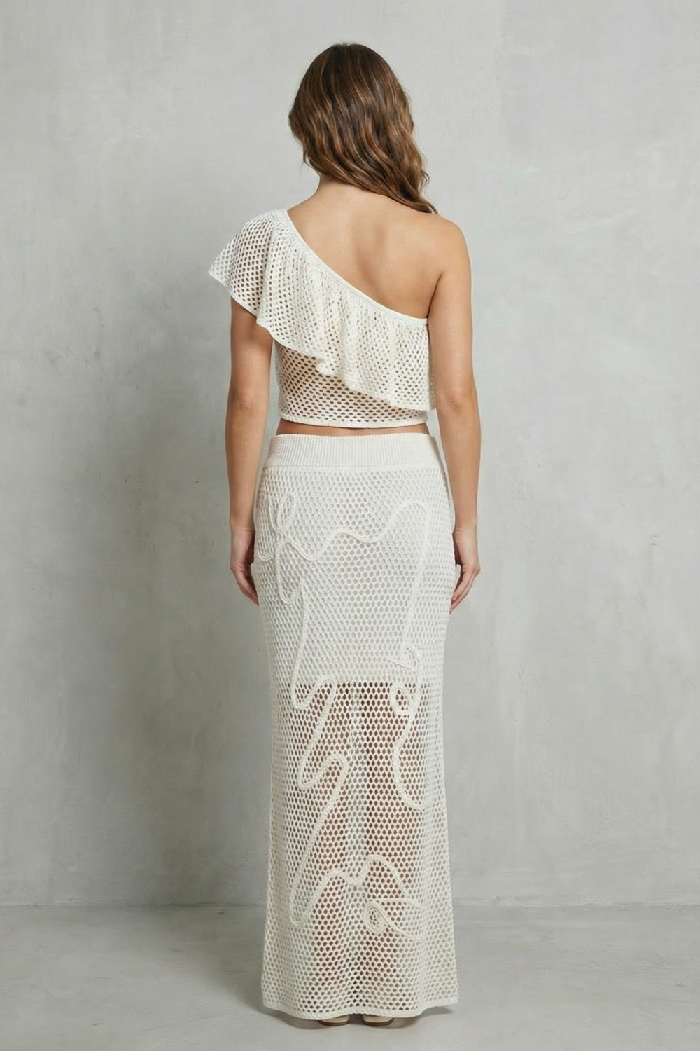 Solmara – Elegância com babados vazados – Conjunto de saia em tricô